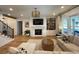 Light-filled living room with hardwood floors, fireplace, and comfortable seating at 206 Green Lake Dr., Myrtle Beach, SC 29572