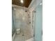 Walk-in shower with marble tile and built-in shelves at 206 Green Lake Dr., Myrtle Beach, SC 29572