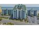 Aerial view of a beachfront resort with palm trees, parking, and ocean views at 6804 N Ocean Blvd. # 1037, Myrtle Beach, SC 29572