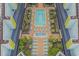 Aerial view of a pool and hot tub surrounded by plants and lounge seating at 6804 N Ocean Blvd. # 1037, Myrtle Beach, SC 29572