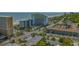 Aerial view of a beachfront resort with pools, palm trees, and parking at 6804 N Ocean Blvd. # 1037, Myrtle Beach, SC 29572