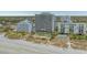 Aerial view of a beachfront resort with pool, palm trees, and beach access at 6804 N Ocean Blvd. # 1037, Myrtle Beach, SC 29572