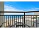 Balcony overlooking the beach and ocean with a table and chairs at 6804 N Ocean Blvd. # 1037, Myrtle Beach, SC 29572