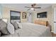 Comfortable bedroom with a king bed, dresser, and mounted TV at 6804 N Ocean Blvd. # 1037, Myrtle Beach, SC 29572