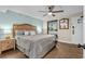 Cozy bedroom features a king-sized bed, wood-look tile flooring, and neutral decor at 6804 N Ocean Blvd. # 1037, Myrtle Beach, SC 29572