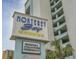 Monterey Bay Suites sign advertising indoor pools, spa, lazy river, and free breakfast at 6804 N Ocean Blvd. # 1037, Myrtle Beach, SC 29572