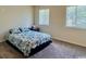 Bright bedroom featuring two windows for natural light and a comfortable queen size bed at 923 Fairwood Lakes Ln. # 23-Q, Myrtle Beach, SC 29588