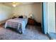 Neutral bedroom with ceiling fan, sliding glass doors to porch and queen size bed at 923 Fairwood Lakes Ln. # 23-Q, Myrtle Beach, SC 29588