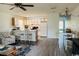 Open concept living room and kitchen with white cabinets, ceiling fan and modern flooring at 923 Fairwood Lakes Ln. # 23-Q, Myrtle Beach, SC 29588