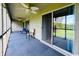 Relaxing screened porch with ceiling fans, providing outdoor living space and access to backyard and sunroom at 923 Fairwood Lakes Ln. # 23-Q, Myrtle Beach, SC 29588