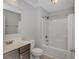 Well-lit bathroom with tub, toilet and vanity at 103 Palmetto Green Dr. # 103, Longs, SC 29568