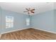 Spacious bedroom with light walls and wood-look flooring at 103 Palmetto Green Dr. # 103, Longs, SC 29568