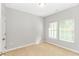 Bright bedroom with neutral walls and two windows at 103 Palmetto Green Dr. # 103, Longs, SC 29568