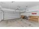 Attached garage with overhead storage and workbench at 103 Palmetto Green Dr. # 103, Longs, SC 29568