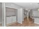 Well-lit laundry room with washer and dryer, and built-in shelving at 103 Palmetto Green Dr. # 103, Longs, SC 29568