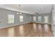 Spacious living room featuring hardwood floors and abundant natural light at 103 Palmetto Green Dr. # 103, Longs, SC 29568