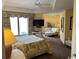 Bright bedroom featuring a TV, ceiling fan, seating area, and large windows with beautiful views at 8500 Margate Circle # 2005, Myrtle Beach, SC 29572