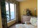 Bright bedroom featuring a seating area, dresser, and a large window with a view at 8500 Margate Circle # 2005, Myrtle Beach, SC 29572
