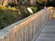 A white heron stands on a wooden bridge at 8500 Margate Circle # 2005, Myrtle Beach, SC 29572