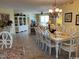 Bright open-concept interior with large dining table, hutch, and chandelier at 8500 Margate Circle # 2005, Myrtle Beach, SC 29572