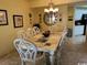 Elegant dining room with chandelier and seating for eight at 8500 Margate Circle # 2005, Myrtle Beach, SC 29572