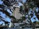 View of the exterior through mature landscaping at 8500 Margate Circle # 2005, Myrtle Beach, SC 29572
