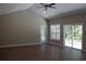 Bright, spacious living room boasting vaulted ceilings, modern ceiling fan and sliding doors to the outdoors at Tbd 6 Privetts Rd., Conway, SC 29526