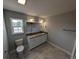 Bathroom featuring a double vanity with granite countertop, white cabinets, and modern fixtures at Tbd 9 Privetts Rd., Conway, SC 29526