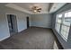 Spacious bedroom with a ceiling fan, large window, neutral paint, and carpet flooring at Tbd 9 Privetts Rd., Conway, SC 29526