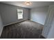 Simple bedroom with soft carpet, gray walls, a window, and a flush ceiling light at Tbd 9 Privetts Rd., Conway, SC 29526