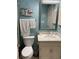 Bathroom featuring a white vanity and a decorative mirror, complemented by beach-themed accents at 9621 Shore Dr. # J-229, Myrtle Beach, SC 29572