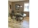 Dining area with glass table, chairs, and chandelier provide an inviting area for meals at 9621 Shore Dr. # J-229, Myrtle Beach, SC 29572