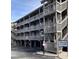 Exterior of condo shows elevated structure, wooden stairs, parking, and signage for Shipwatch Pointe at 9621 Shore Dr. # J-229, Myrtle Beach, SC 29572