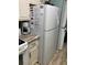 Kitchen featuring white refrigerator, countertops, backsplash, and upper and lower cabinets at 9621 Shore Dr. # J-229, Myrtle Beach, SC 29572
