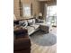 Cozy living room featuring a plush sectional sofa, accent pillows, and a view to the outdoor patio at 9621 Shore Dr. # J-229, Myrtle Beach, SC 29572