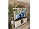 Living room with a large TV cabinet, complete with decorative items and ample storage space at 9621 Shore Dr. # J-229, Myrtle Beach, SC 29572