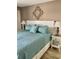 Serene main bedroom with a comfortable bed, decorative pillows, and stylish bedside lamps at 9621 Shore Dr. # J-229, Myrtle Beach, SC 29572