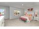 Bedroom with natural light, bedside tables, and a view of the outside neighborhood at 121 Fair Meadow Ct., Loris, SC 29569