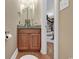 Half bathroom featuring wood cabinets, granite countertop, and modern fixtures at 816 Waterton Ave., Myrtle Beach, SC 29579