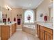 Well-lit bathroom featuring double vanities, a soaking tub, and neutral decor at 816 Waterton Ave., Myrtle Beach, SC 29579