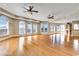 Open concept living room featuring large windows and doors and hardwood flooring throughout at 816 Waterton Ave., Myrtle Beach, SC 29579