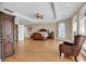 Expansive main bedroom featuring hardwood floors, tray ceilings, and large windows at 816 Waterton Ave., Myrtle Beach, SC 29579