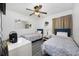 Comfortable bedroom featuring twin beds, ceiling fan and storage at 9600 Shore Dr. # A-102, Myrtle Beach, SC 29572