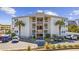 Exterior of a multi-story condo building with white siding, multiple balconies, and parking at 9600 Shore Dr. # A-102, Myrtle Beach, SC 29572