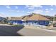 Exterior view of the bright blue commercial building with a bar and grill and ample parking spaces at 9600 Shore Dr. # A-102, Myrtle Beach, SC 29572