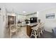 Open kitchen with a breakfast bar, granite countertops, and an adjacent dining area at 9600 Shore Dr. # A-102, Myrtle Beach, SC 29572