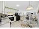 Charming kitchen open to the living area, featuring modern appliances and a cozy dining space at 9600 Shore Dr. # A-102, Myrtle Beach, SC 29572
