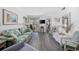 Bright living room featuring coastal decor, comfortable seating, and sliding glass doors to a balcony at 9600 Shore Dr. # A-102, Myrtle Beach, SC 29572