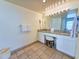 Bright bathroom with granite counters, double sinks, and vanity seating for added convenience at 9820 Queensway Blvd. # 501, Myrtle Beach, SC 29572