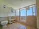 Modern bathroom with tiled floor, glass shower, and shelving unit for organized storage at 9820 Queensway Blvd. # 501, Myrtle Beach, SC 29572